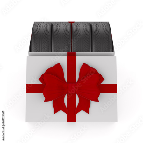 tires into gift box on whit...