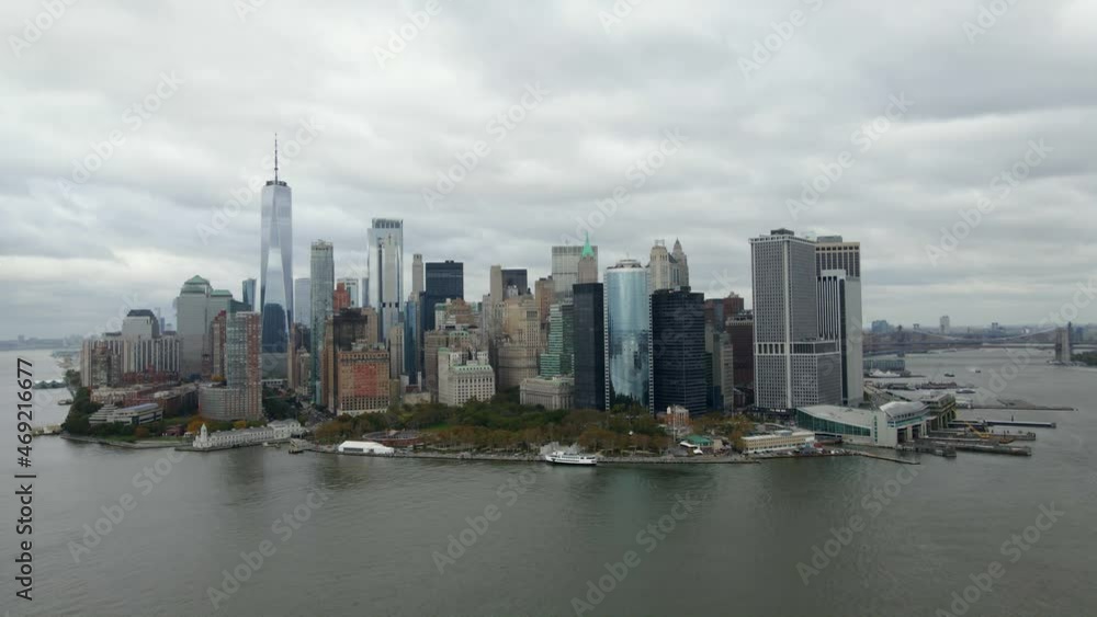 Aerial drone view towards the lower Manhattan skyline from Hudson river, in cloudy NYC, USA Aerial drone view towards the lower Manhattan skyline from Hudson river, in cloudy NYC, USA