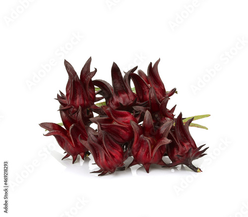 Fresh roselle fruits pile with leaves isolated on white background