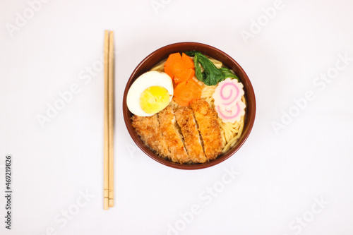 delicious ramen and a pair of chopsticks isolated on white background