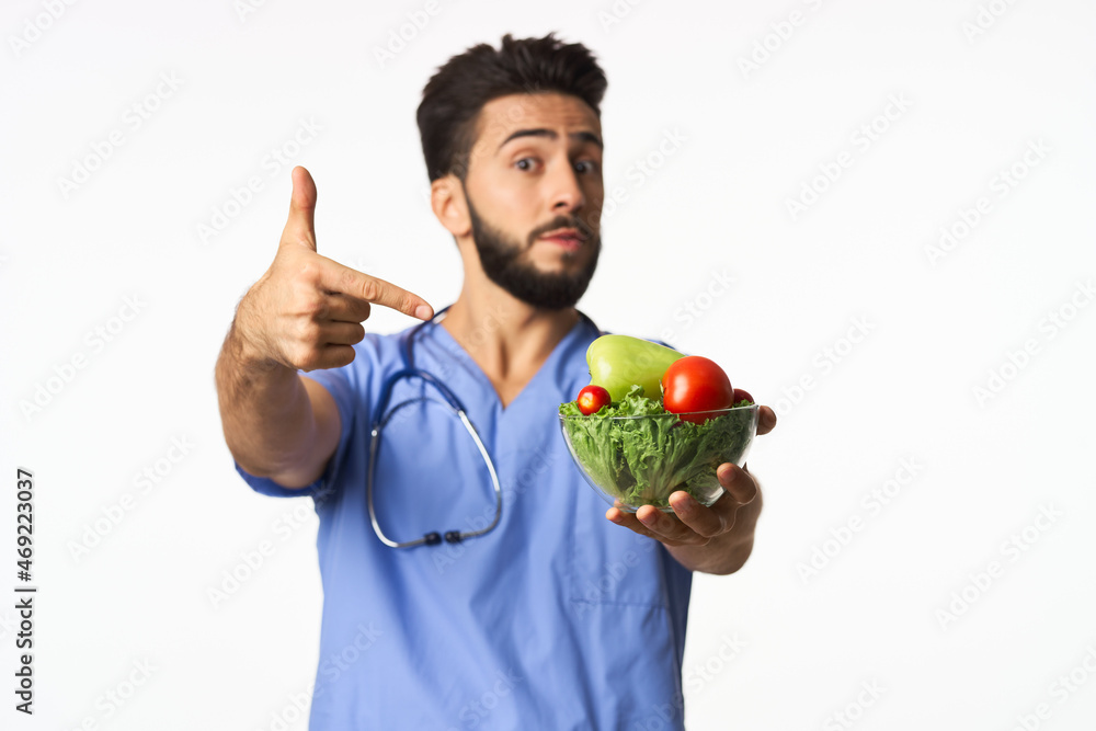 male doctor plate with vegetables healthy food nutritionist male doctor plate with vegetables healthy food nutritionist