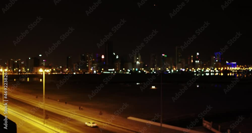 Getting in focus night cityscape skyscrapers seen from Juffair District, Bahrain Getting in focus night cityscape skyscrapers seen from Juffair District, Bahrain