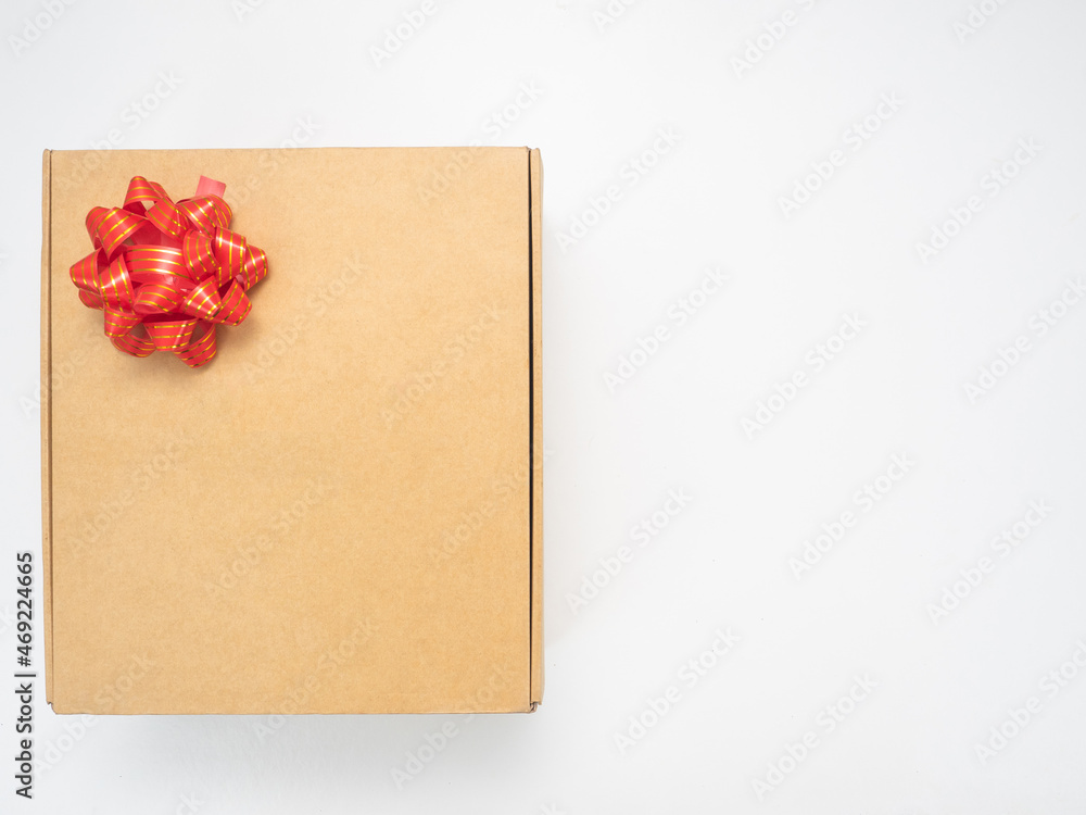 Gift box red ribbon on white table top view copy space Gift box red ribbon on white table top view copy space
