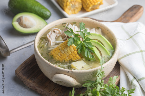 Traditional Ajiaco Colombiano - Colombian Soup with potato, chicken, avocado photo