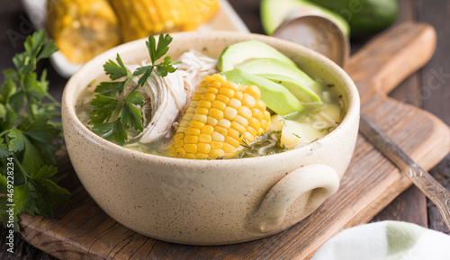 Traditional Ajiaco Colombiano - Colombian Soup with potato, chicken, avocado