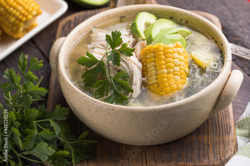 Traditional Ajiaco Colombiano - Colombian Soup with potato, chicken, avocado photo