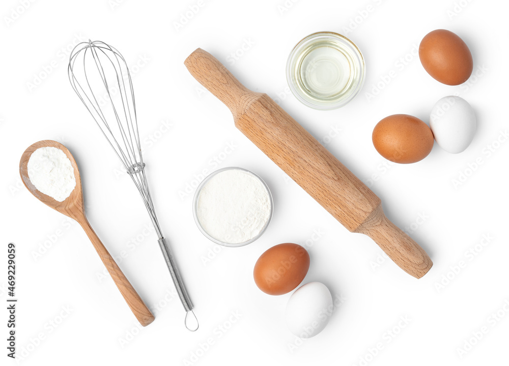 Metal whisk and eggs for cooking isolated on white Metal whisk and eggs for cooking isolated on white