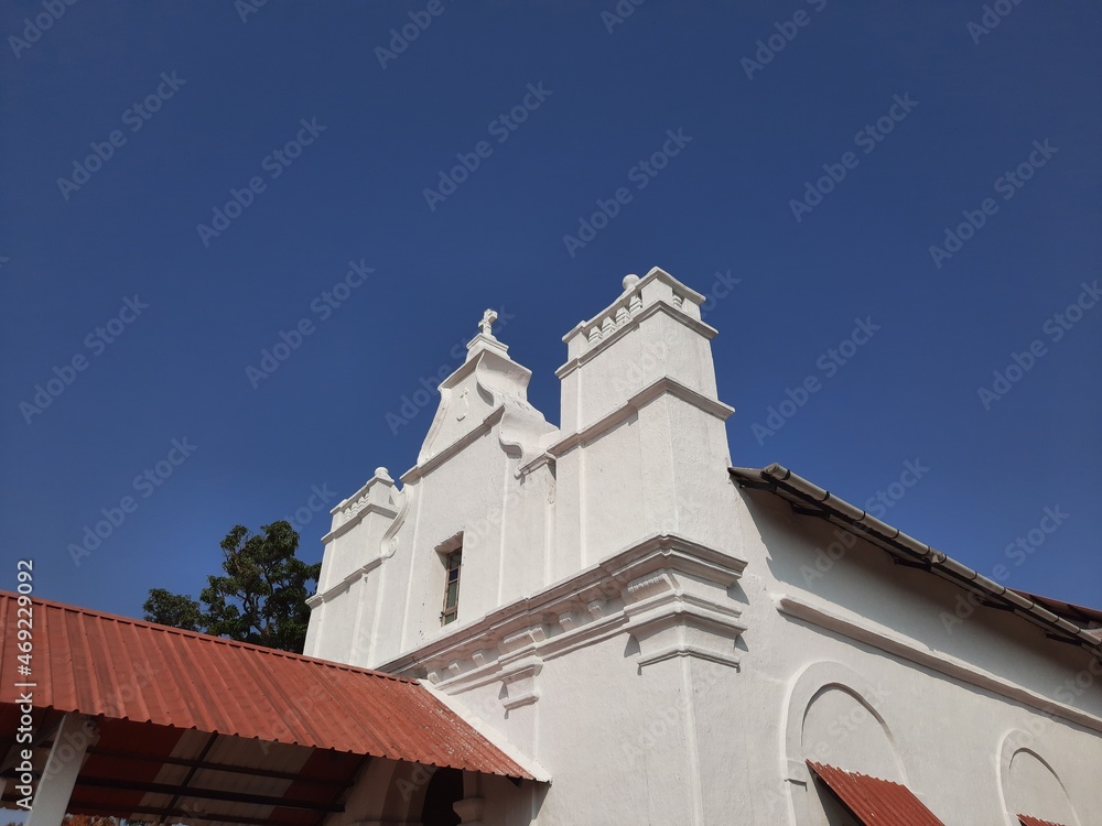 Three Kings church in goa, goa church, white color Portuguese church in Goa. blue background with white church.