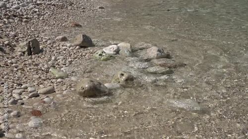 Buyukcakil beach, Kas, Turkey - 27th of May 2021: Soft swell on pebble sandy beach
 photo