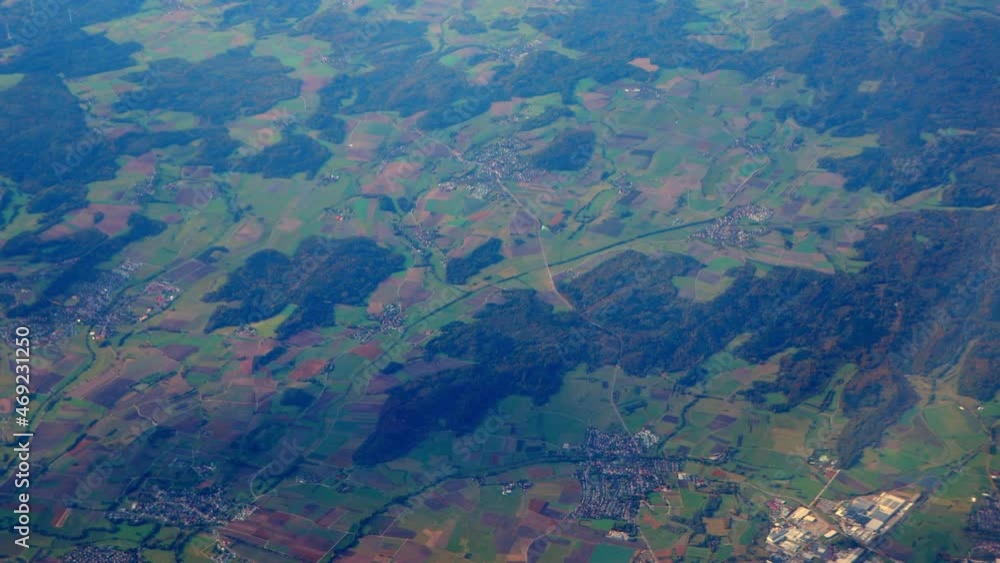 Wide panorama view of rural agricultural farm fields and hills from high plane Wide panorama view of rural agricultural farm fields and hills from high plane