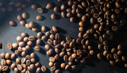 Flying coffee beans over dark
