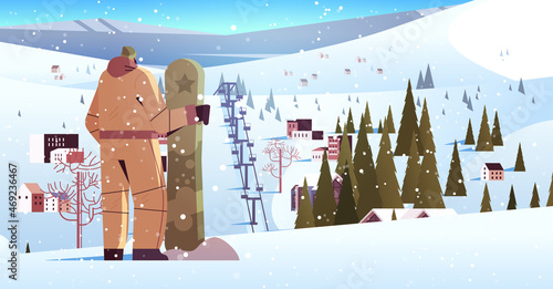 snowboarder man standing with snowboard sportsman snowboarding doing activities winter vacation concept
