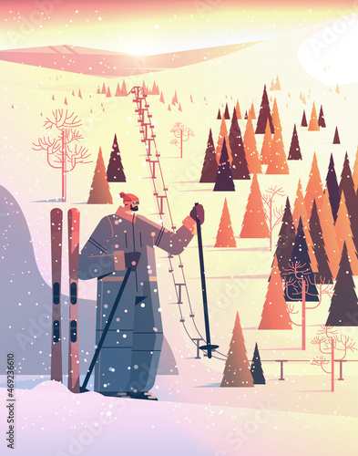 skier man sportswoman skiing doing activities winter vacation concept sunset snowfall landscape background