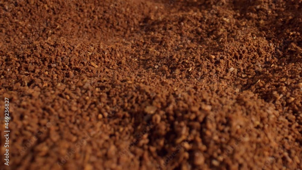 Aromatic ground coffee is scattered on the surface of the table. The concept of high quality coffee production. Vivacity for the whole day. High quality. 4k footage. Aromatic ground coffee is scattered on the surface of the table. The concept of high quality coffee production. Vivacity for the whole day. High quality. 4k footage.