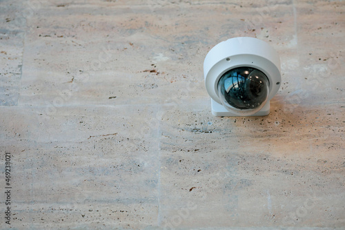 Details with a CCTV camera on a wall inside a building.