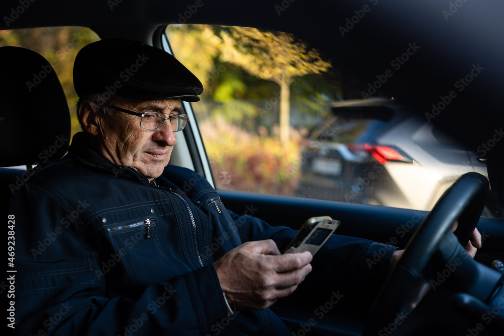 Elderly person driving a car. elderly man in a car Elderly person driving a car. elderly man in a car