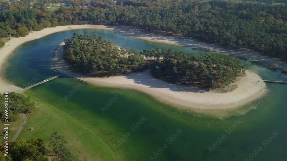 Aerial drone view of the small island in the middle of the lake in the tropical paradise looked in the Netherlands, Europe. Aerial drone view of the small island in the middle of the lake in the tropical paradise looked in the Netherlands, Europe.