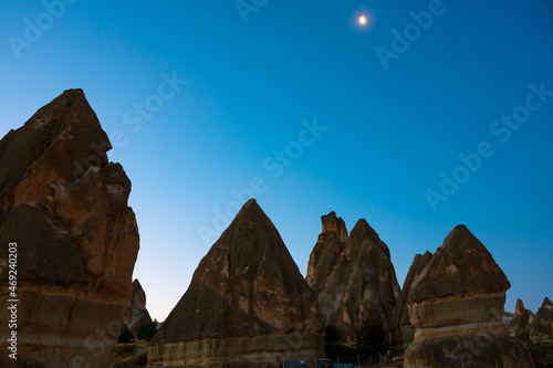 Fairy Chimneys. Peri bacalari or fairy chimneys at sunrise with moon on the sky photo