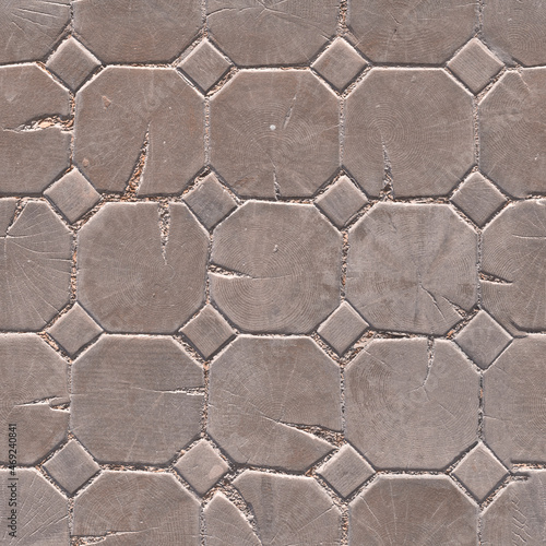 Wooden tiles on the ground. Background of hexagonal tiles. The texture of the tree. The theme of construction Paving stones made of wood. Texture with wooden paving stones. Paving slabs. 3D-rendering
