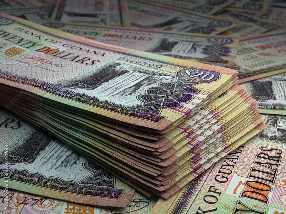 Guyanese money. Guyanese dollar banknotes. 20 GYD dollars bills. Stock
