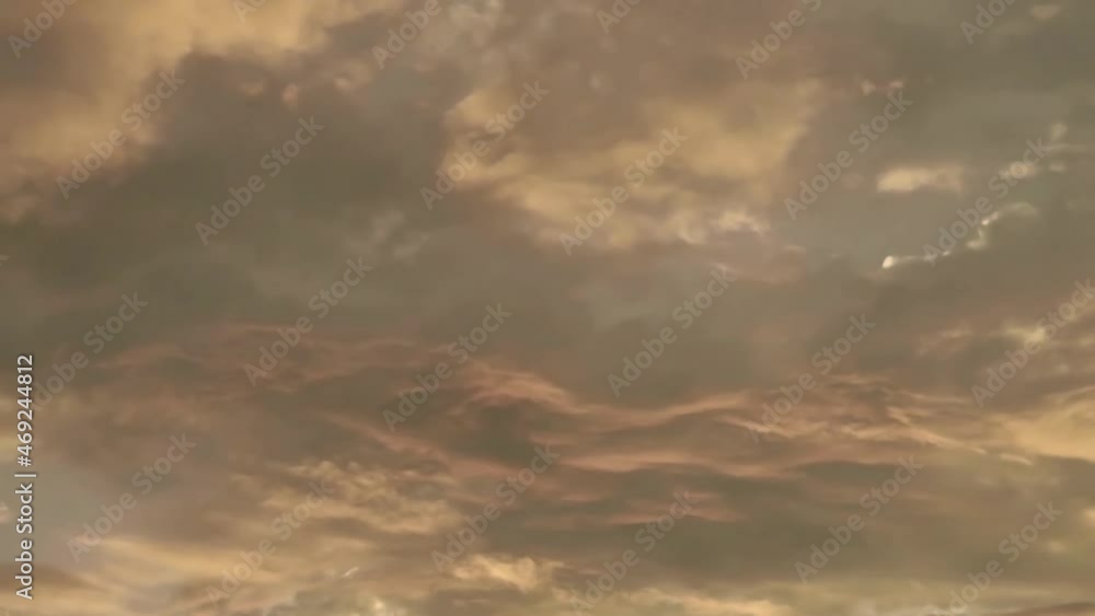 time lapse of dramatic colorful clouds at sunrise or sunset
time lapse of dramatic colorful clouds at sunrise or sunset