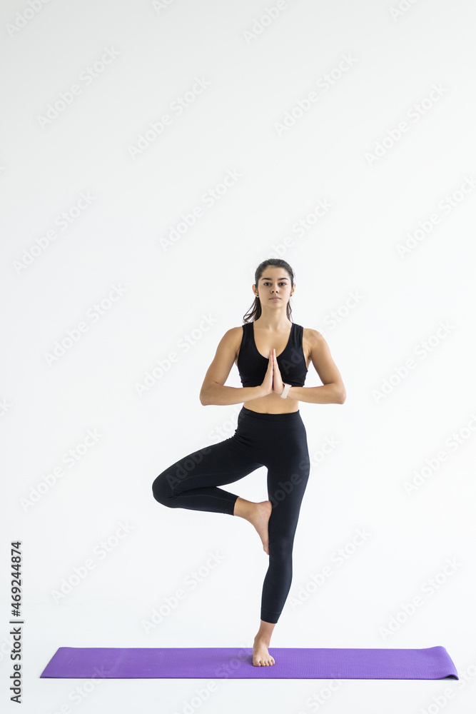 woman working yoga exercise tree-pose isolated on white background woman working yoga exercise tree-pose isolated on white background
