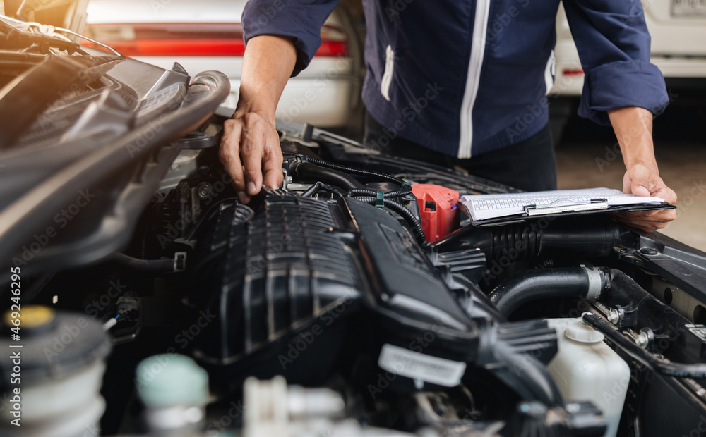 Automobile mechanic repairman hands repairing a car engine automotive workshop with a wrench, car service and maintenance,Repair service. Automobile mechanic repairman hands repairing a car engine automotive workshop with a wrench, car service and maintenance,Repair service.