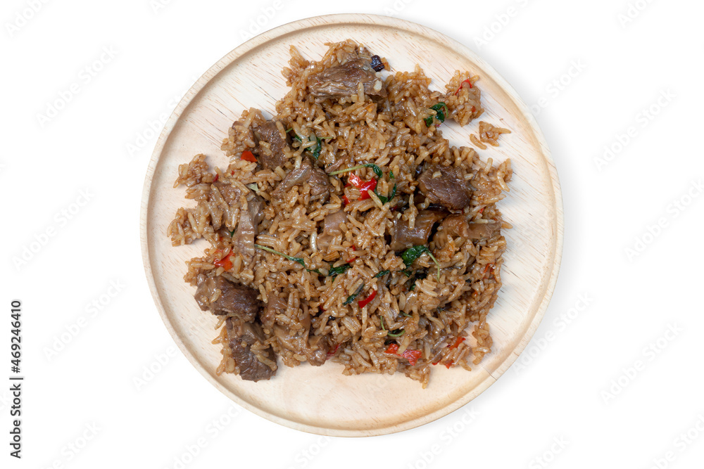 Braised Pork with Basil mixed with rice. on a flat wooden plate. with isolated white background. Braised Pork with Basil mixed with rice. on a flat wooden plate. with isolated white background.
