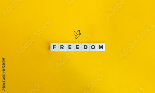 Freedom Word, Banner and Conceptual Image. Block letters on bright orange background. Minimal aesthetics.