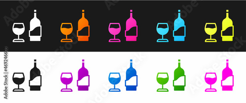 Set Wine bottle with glass icon isolated on black and white background. Vector