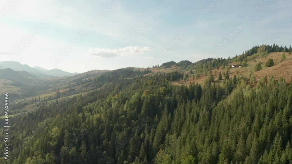 Picturesque view of mountains on sunny day. Drone rising, camera panning left Picturesque view of mountains on sunny day. Drone rising, camera panning left