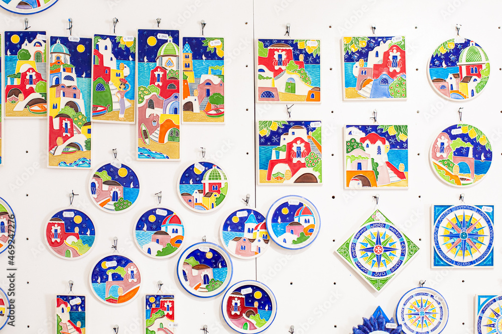 brightly colored ceramic tiles adorn the whitewashed Mediterranean street