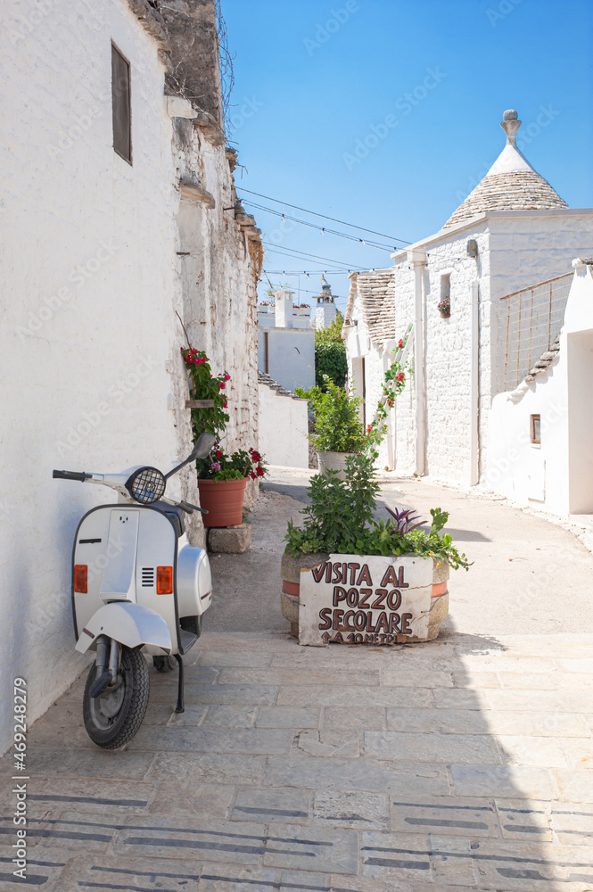 Obraz premium white traditional southern italian trulli village houses with tapered stone roofs