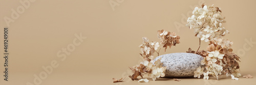 Rounded pebbles podium and dried flowers. Trending Banner for presentation of eco friendly and zero waste products in earth colors