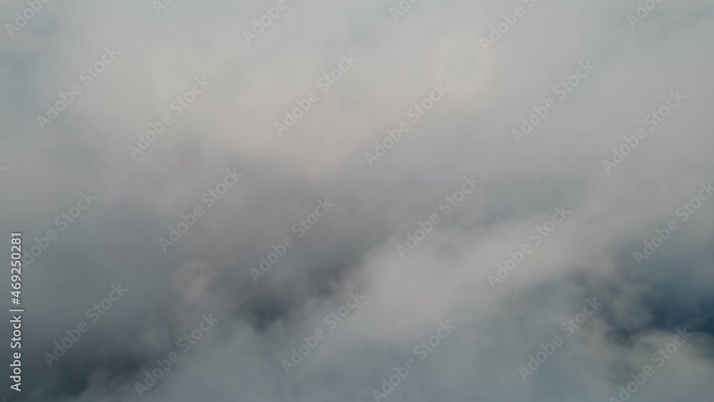 Fly through the clouds during sunrise. An epic shot of clouds in morning colors. Fly through the clouds during sunrise. An epic shot of clouds in morning colors.