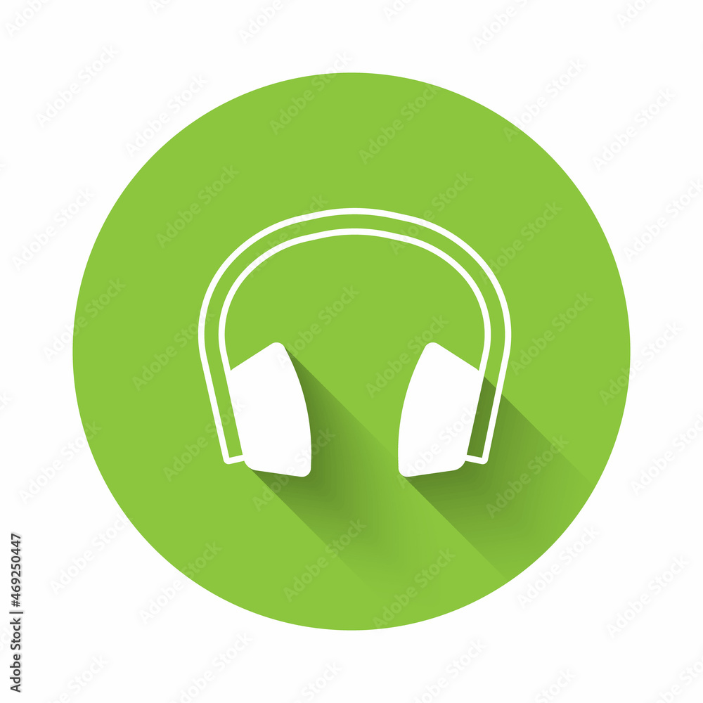 White Noise canceling headphones icon isolated with long shadow background. Headphones for ear protection from noise. Green circle button. Vector White Noise canceling headphones icon isolated with long shadow background. Headphones for ear protection from noise. Green circle button. Vector