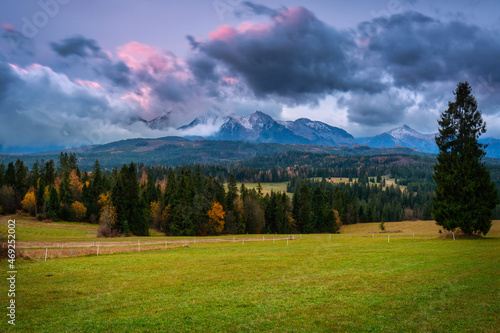 A cloudy sunrise over the autumnal Tatra Mountains. The pass over Lapszanka in Poland.