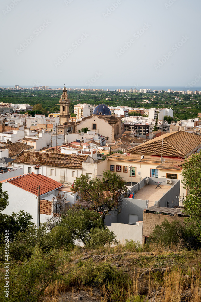 Roof view on old city of Oliva with the church tower of 'Santa Maria la Mayor' reaching out, Spain