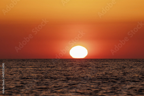 sun at sunrise in the Mediterranean sea on a summer day