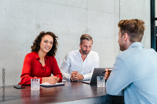 Businesswoman taking job interview with male colleague in office