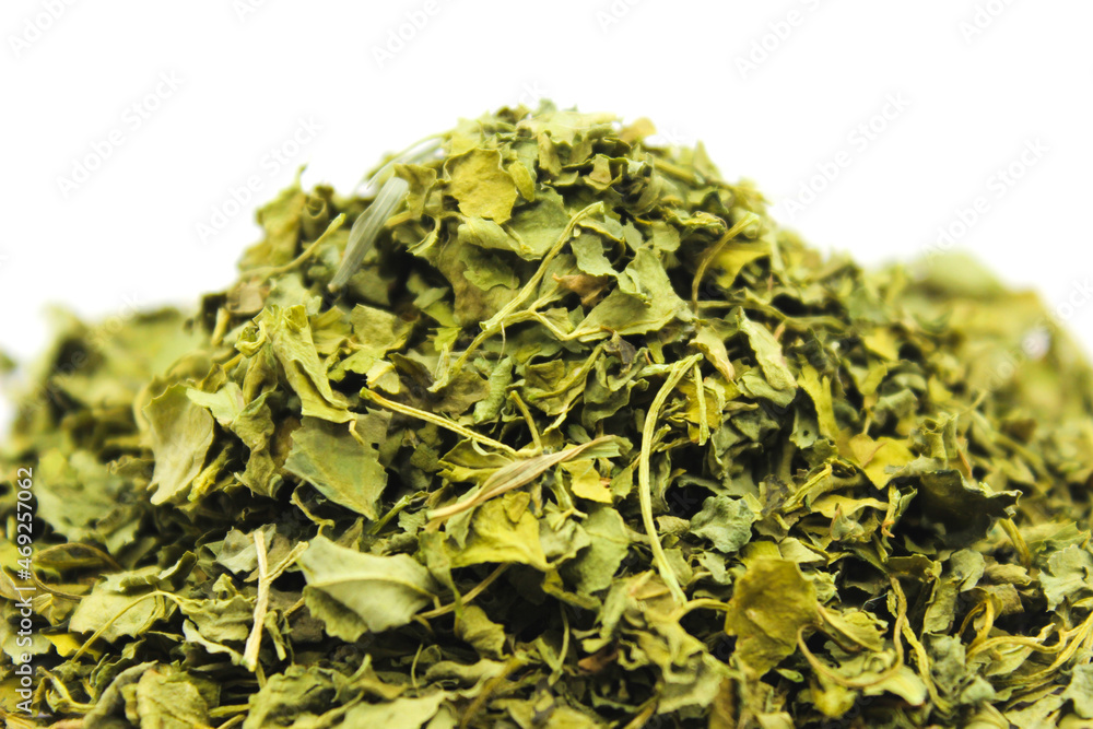 Kasuri Methi on white background with selective focus Kasuri Methi on white background with selective focus
