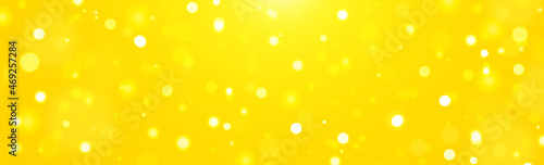 holiday background banner bokeh sunlight on yellow gold background