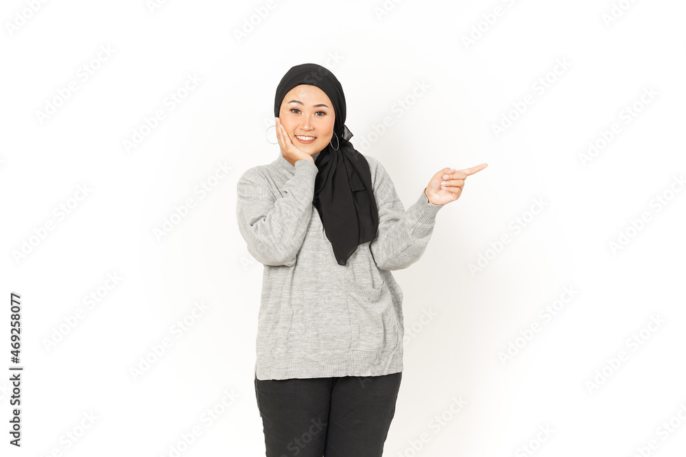 Pointing aside of Beautiful Asian Woman Wearing Hijab Isolated On White Background Pointing aside of Beautiful Asian Woman Wearing Hijab Isolated On White Background