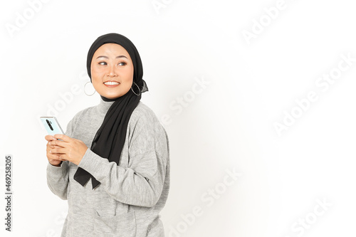 Smile and Using Smartphone of Beautiful Asian Woman Wearing Hijab Isolated On White Background