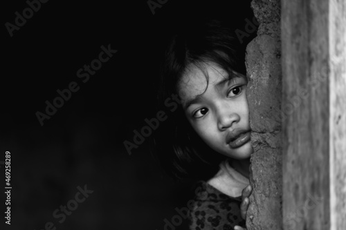 Little girl with eye sad and hopeless. Human trafficking and fear child concept. black and white image