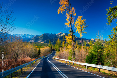 Fototapeta Naklejka Na Ścianę i Meble -  Autumnal landscape of the road to the Tatra Mountains, Poland.