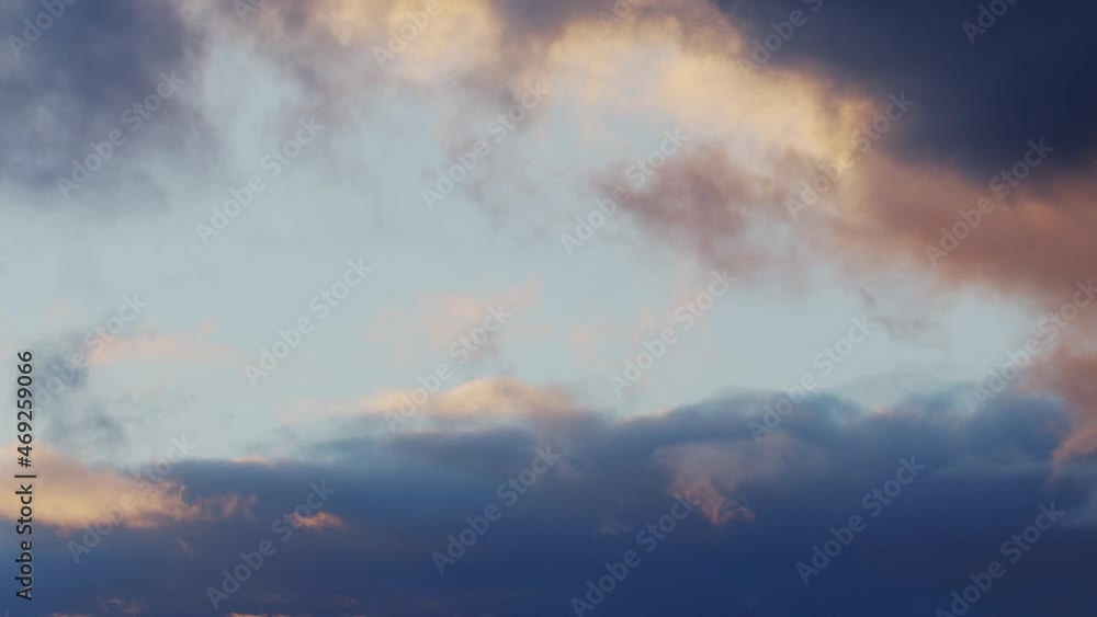 Close-up 4K time lapse video of dark blue and yellow big clouds on a evening sky. Effect of flying an airplane through the clouds. Close-up 4K time lapse video of dark blue and yellow big clouds on a evening sky. Effect of flying an airplane through the clouds.