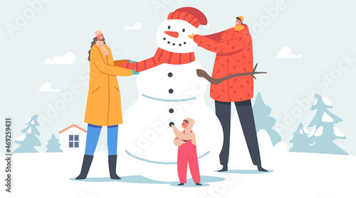 Happy Parents with Children Making Snowman on Nature. Father, Mother and Baby Put Scarf and Hat on Snowman Head
