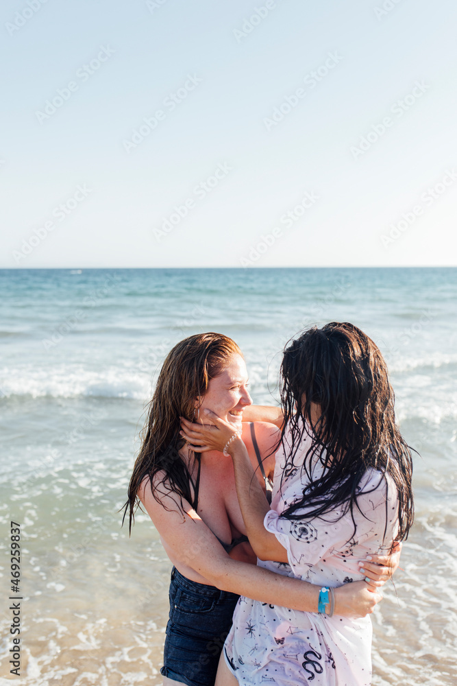 Friends enjoying at beach on sunny day Friends enjoying at beach on sunny day