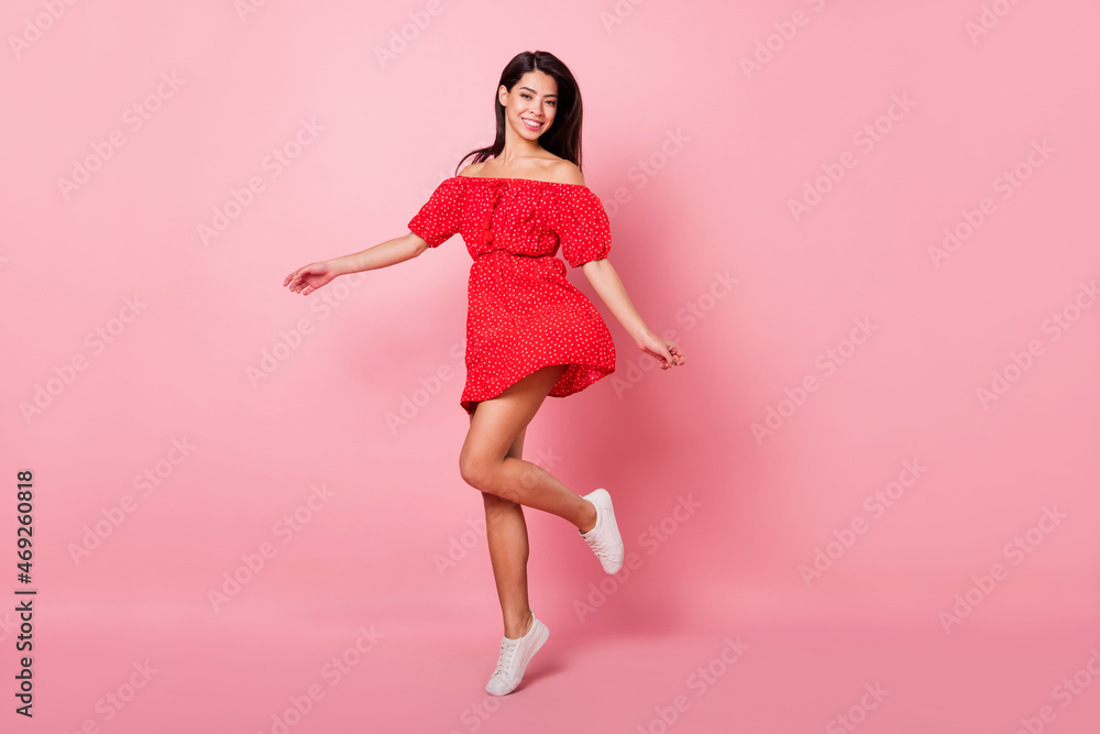 Full body photo of funky millennial lady dance wear red dress isolated on pastel pink color background